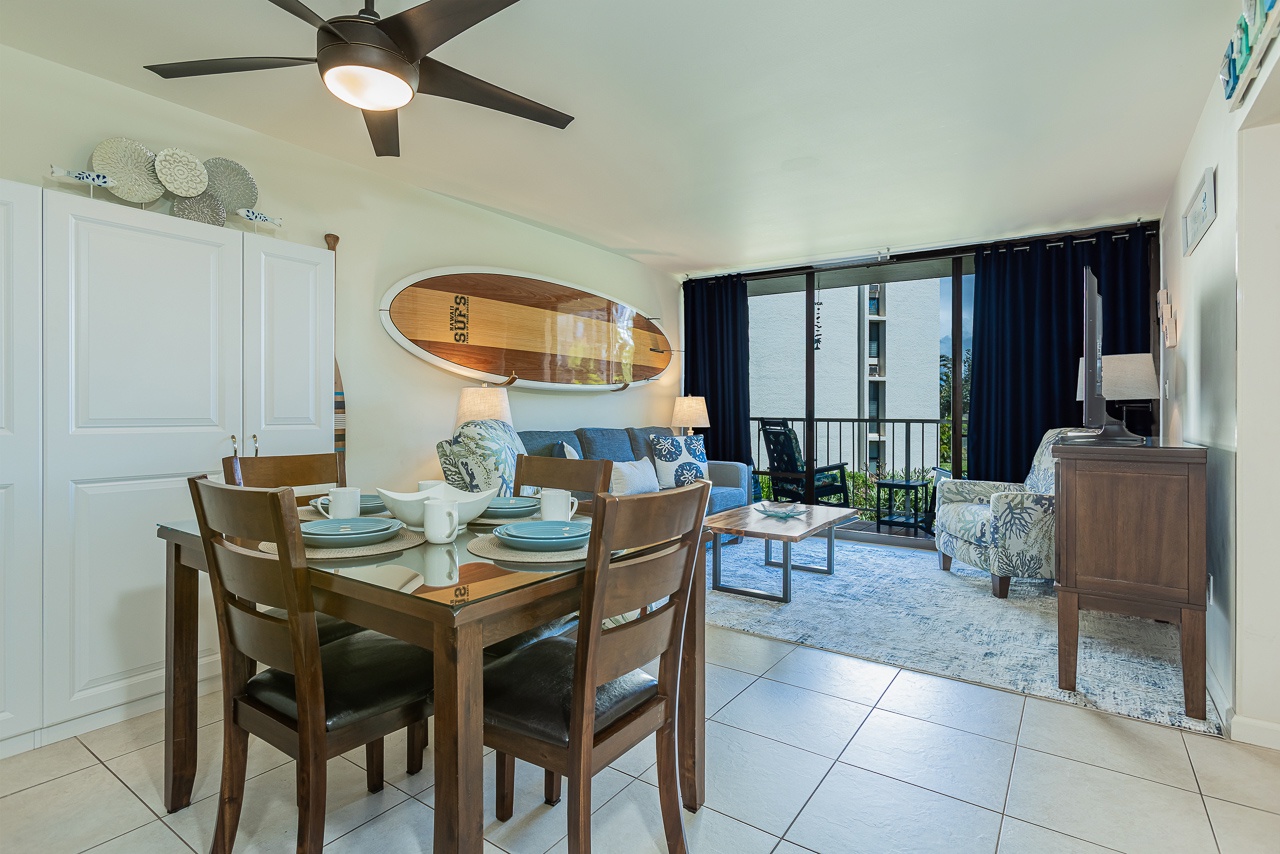 Relax in your coastal-inspired living space where surf-themed decor meets comfort. The dining area flows seamlessly into your lounge with balcony views.