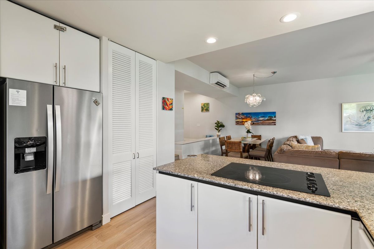 Step into your modern kitchen with granite counters and stainless appliances, flowing seamlessly into a bright open living and dining area. Everything you need to cook, relax, and make yourself at home.