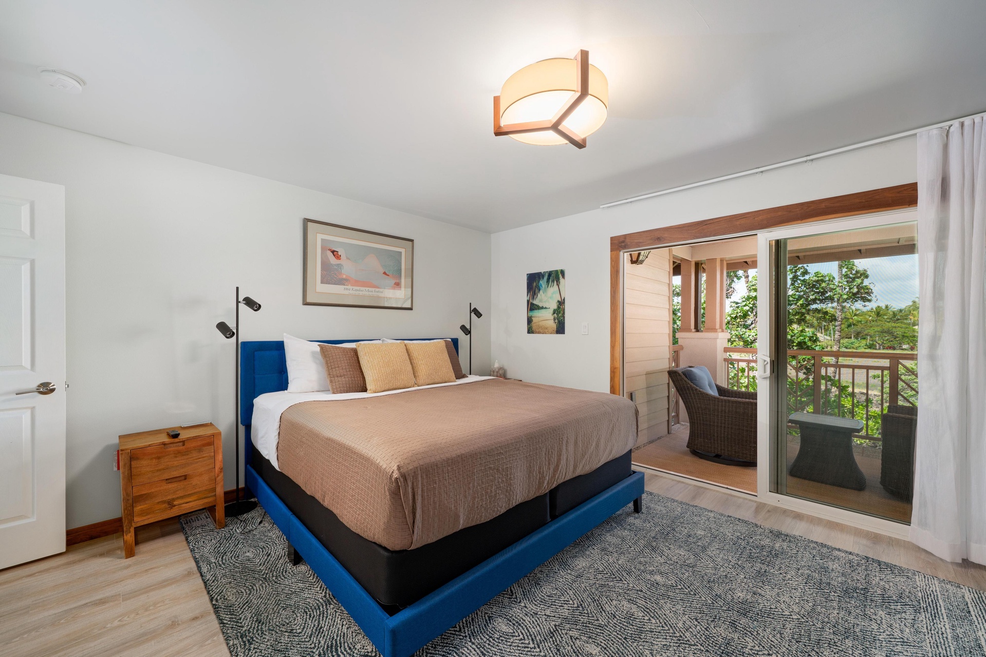 Rest peacefully in your coastal-inspired bedroom with modern touches and private balcony access overlooking nature.