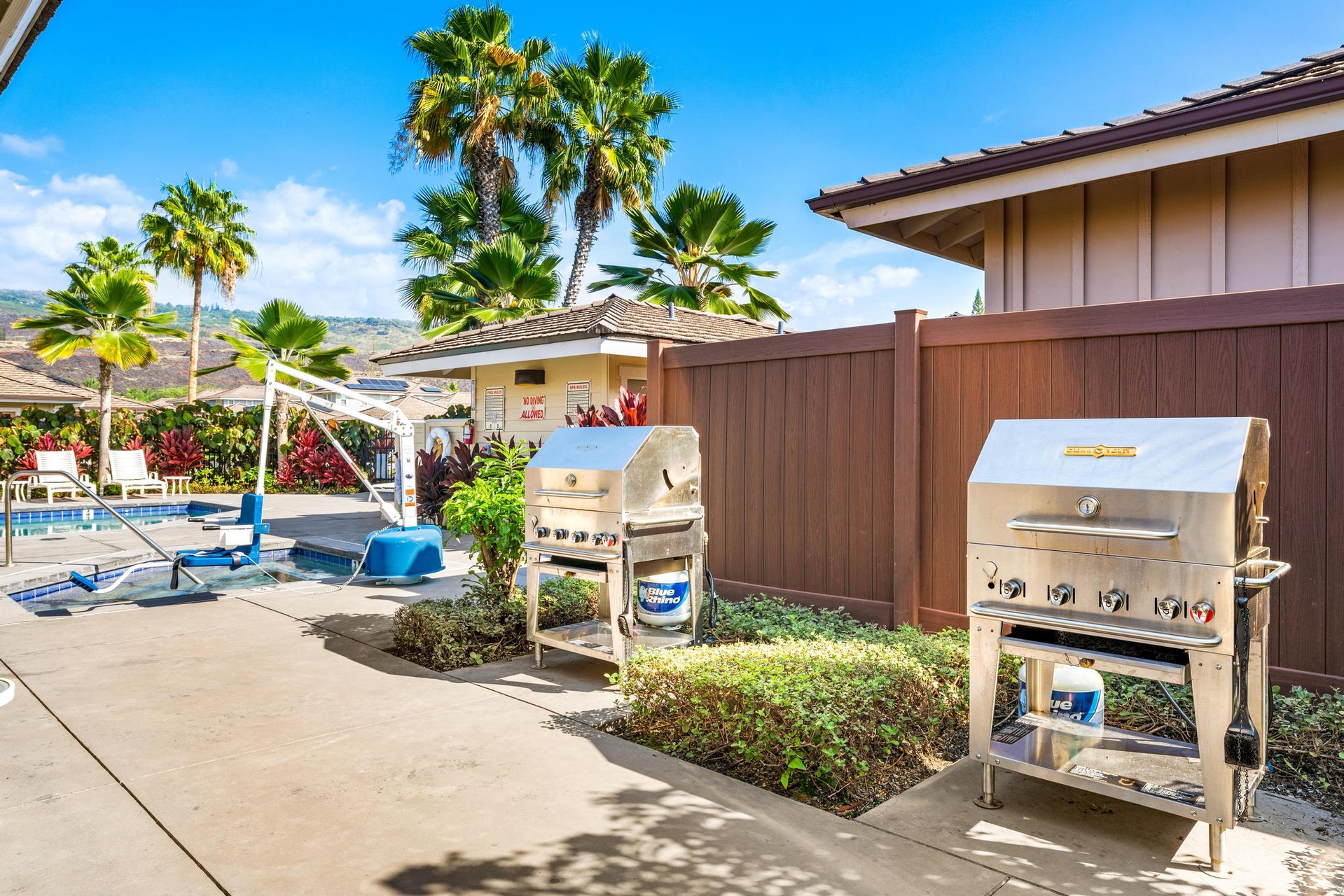 Enjoy outdoor cooking while relaxing by the pool