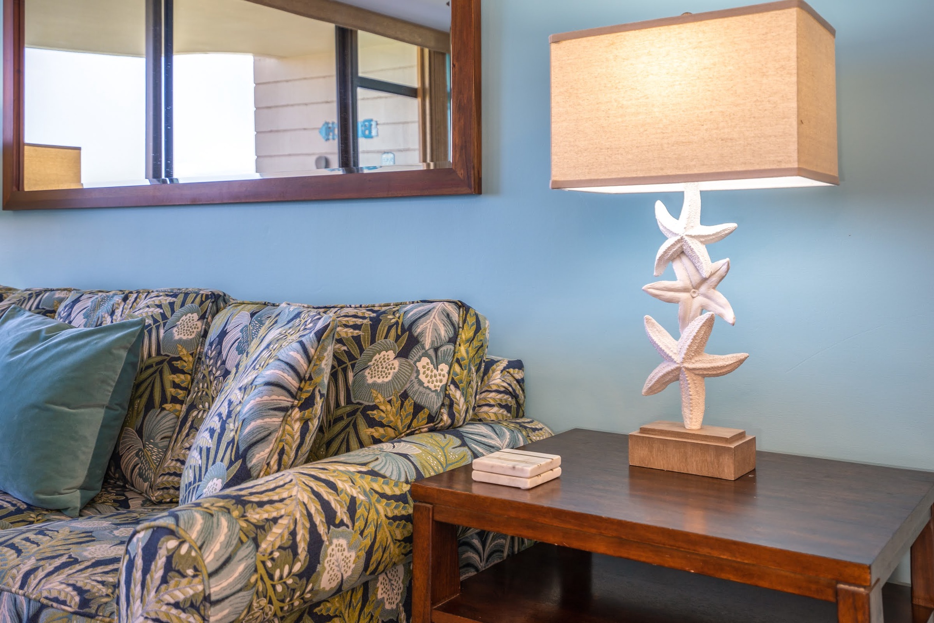 Unwind in your cozy coastal retreat with tropical-inspired furnishings.
