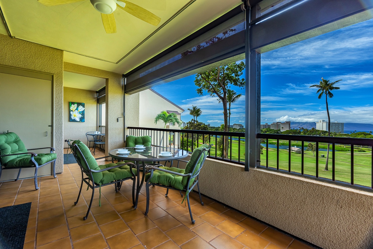 Unwind on your private lanai with sweeping golf course and ocean views, where lush palm trees frame brilliant blue skies and comfortable seating invites you to savor every sunset.