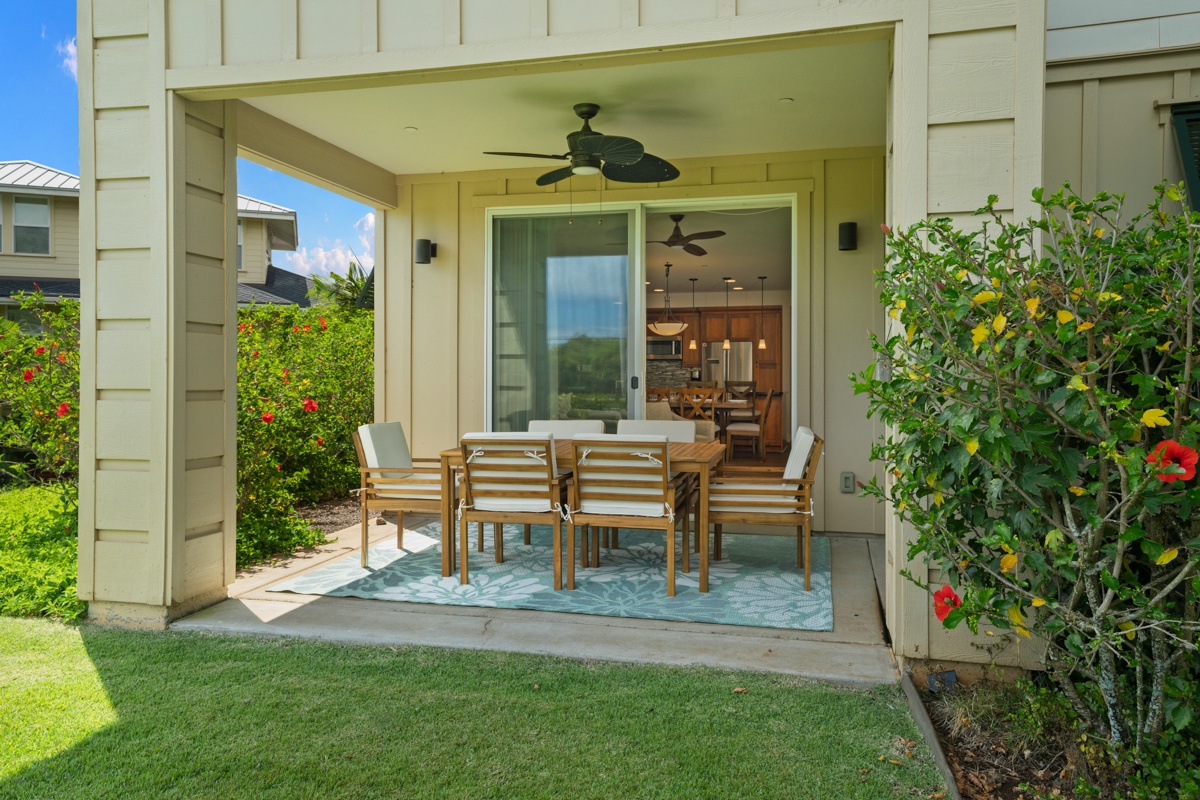 Your covered patio flows seamlessly from kitchen to garden, perfect for morning coffee or evening dinners surrounded by tropical blooms.