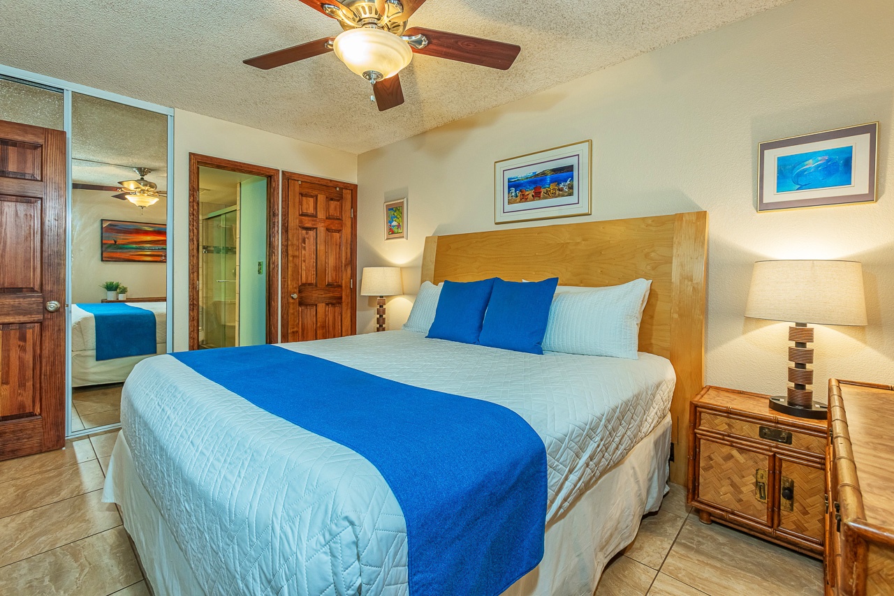 Settle into your cozy bedroom with crisp linens, warm lighting, and coastal artwork that sets a relaxing tone for your getaway.
