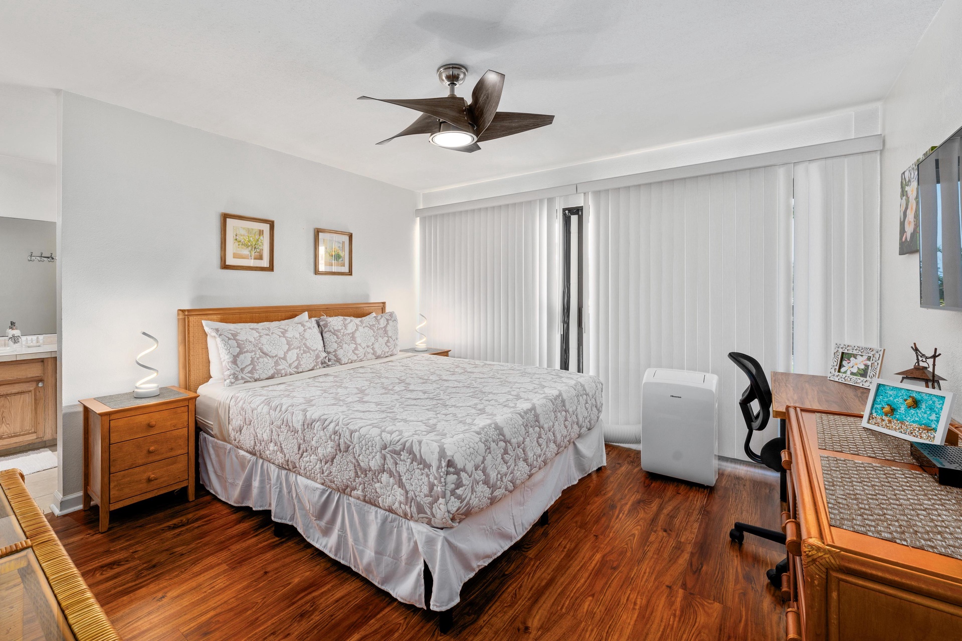 Primary bedroom equipped with a portable air conditioner