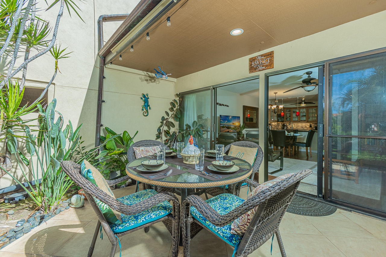 Your tropical dining terrace invites leisurely meals surrounded by lush plants.