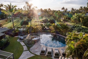 Start your morning with sunrise views over the pool, palms, and fairway.