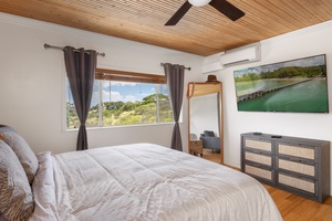 Relax with mountain views and natural light in this quiet queen suite—ideal for rest, reading, or catching up on work.