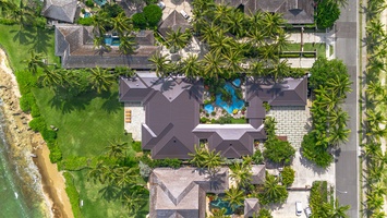 Overhead layout reveals seamless indoor‑outdoor flow, pool, and ocean frontage.