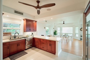 Your spacious kitchen features rich wood cabinets, granite counters, and stainless appliances—perfect for preparing memorable meals during your stay.