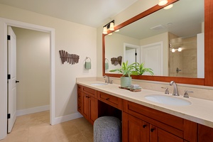 Clean, modern ensuite bathroom with dual vanities and functional layout — practicality meets style.