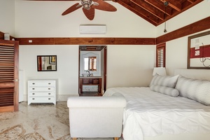 The third guest suite features a king sized bed, footboard bench and split AC.