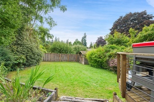 Retreat to this sunlit backyard, an ideal space for families and friends to create lasting memories outdoors.