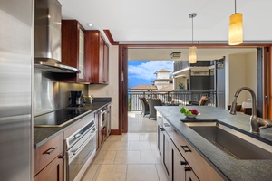 Fully stocked kitchen with stainless steel appliances is a chef's delight.