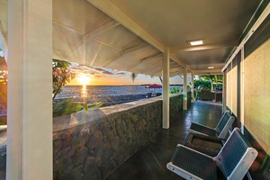 Covered breezeway with shaded lounge seating and ocean breezes.