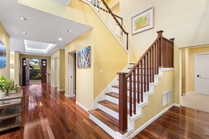 Elegant staircase leading to the upper floor, showcasing thoughtful architectural details.