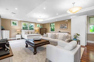 Upstairs studio suite with a living area, perfect for lounging or reading.