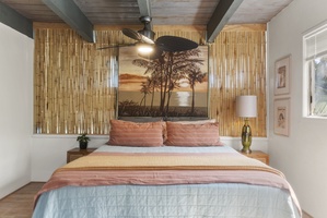 Cozy primary suite with island-inspired decor, warm tones, and a peaceful retreat for relaxation.