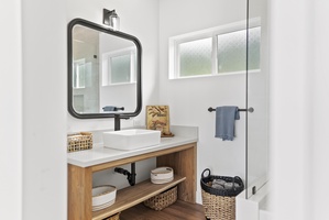 Ensuite bathroom with a chic vanity area, ideal for getting ready in style.
