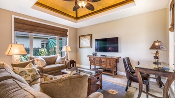 Bonus family room off the kitchen with foosball table, flat-screen TV, and desk area.