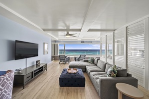 Unwind in your bright living space where ocean views stretch endlessly beyond. and comfortable furnishings invite you to relax.