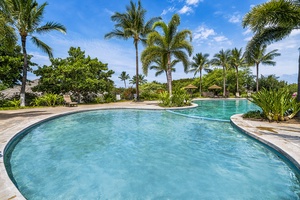 This tropical lagoon-style pool invites guests of all ages to splash and relax under sunny island skies.