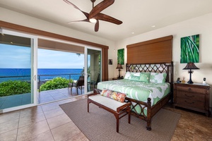 King bed, Koa style ceiling fan, and large sliding doors so the first thing you see each morning is the Pacific in technicolor.