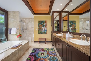 Primary bathroom with soaking tub, dual vanities, and walk-in shower—resort-style pampering at home.