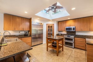 Cook with ease in a fully equipped kitchen with stainless steel appliances.