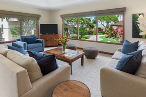 Beach house formal living area designed for relaxation and entertainment.