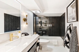 Ensuite luxury full bath to Bedroom #3 with shower/tub combo.