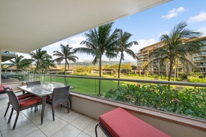 Tropical foliage and golf course views set the stage for relaxed mornings on the lanai of Honua Kai Konea 204.