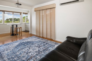 This bonus room can flex as a home office, reading lounge, or guest space—ideal for long-term stays or hybrid work setups.