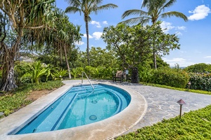 Soak in soothing warmth surrounded by vibrant foliage—a perfect end to a day of exploration or beach time.