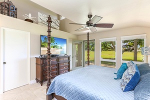 Relax in the spacious primary bedroom with elegant island décor and entertainment.