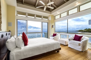 Primary bedroom fit for royalty—California king bed, ocean views, and luxurious natural light.