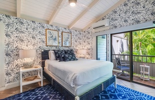 Relax in a sunlit bedroom at Wailea Ekolu 1106, accented with tropical prints and a calm vibe.