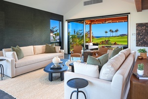 Main living room with retractable glass walls and soft natural light.