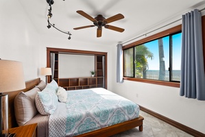 Serene guest house bedroom 1 with cozy queen-sized bed and natural light streaming in.