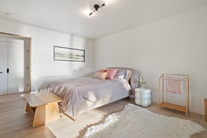 Relax in the guest bedroom after a day of exploration.