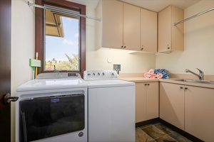 In-unit laundry with washer, dryer, and folding station—perfect for extended stays and family convenience.