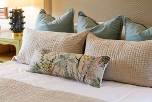 Sink into a cloud of plush pillows with soothing coastal tones and botanical accents—your perfect haven for restful nights and lazy mornings.