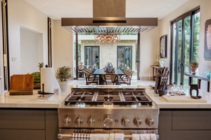 A view from the modern kitchen through to the stylish dining room.