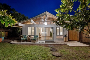 Ohana featuring sleek architecture surrounded by lush greenery and peaceful garden pathways.