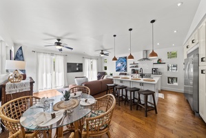 Open-concept living and dining area with modern kitchen, perfect for entertaining.