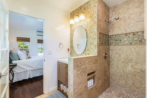 The bathroom has separate walk-in shower.