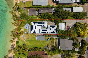 Bird’s-eye view of this private beachfront escape, nestled in tropical paradise.
