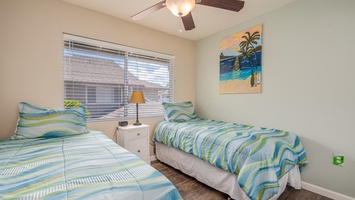Drift off to sleep in your cheerful twin bedroom, where tropical breezes flow and colorful beach vibes create the perfect coastal retreat.