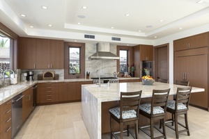 Explansive granite counter spaces for meal prep in the modern appointed kitchen.