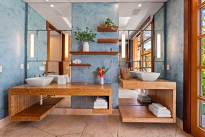Spa-style ensuite with double sinks and garden views.